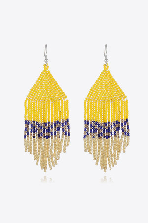Yellow beaded earrings with royal blue and gold fringe detail