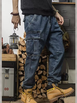 Men's vintage wash denim cargo jeans with elastic cuffs and multiple pockets.