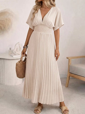 Apricot V-neck midi dress with short sleeves, smocked waist and pleated skirt.