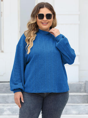Textured balloon sleeve mock neck sweater in Royal Blue with ribbed detail.