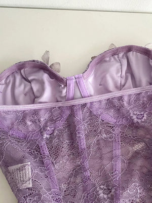 Lavender lace bustier top with 3D butterfly appliques and a bow detail.