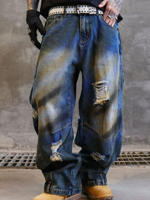 Men's distressed wide-leg jeans in blue cotton with ripped details and a baggy fit.