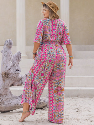 Bohemian palazzo jumpsuit in Deep Rose with bell sleeves and a vibrant paisley print.