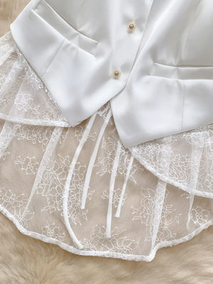 White lace-embellished button-down vest coat with satin lapels and decorative buttons.