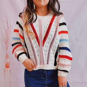 Colorblock openwork knit sweater with V-shaped stripes and horizontal sleeve stripes in multicolor acrylic.