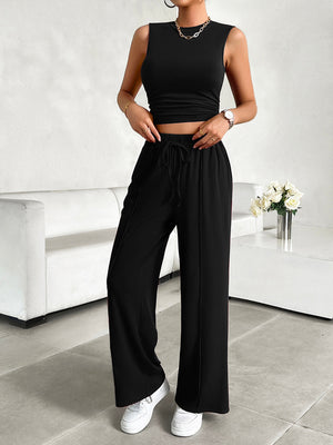 Black ribbed crop top and wide-leg lounge pants with drawstring waist.