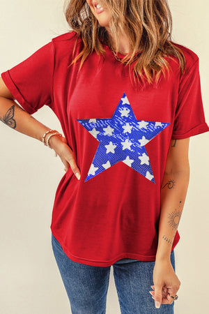 Red cotton blend t-shirt with a blue and white star graphic print on the front.