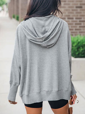 Gray button-down hooded knit pullover with waffle texture and relaxed fit.