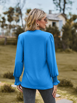 Sky blue blouse with pleated yoke and shirred cuffs