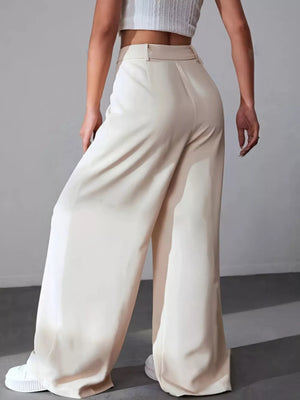 Apricot high-waisted pleated wide-leg maternity trousers with a button-down closure.