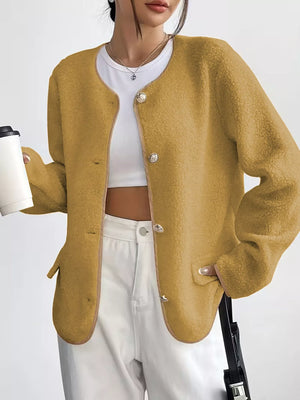 Textured button-up fleece jacket in mustard yellow with ornate buttons and round neckline.