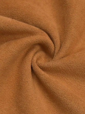 Bohemian tube top in caramel suede-like fabric with fringe detail.