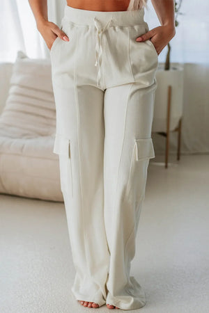 Ivory wide leg cargo pants with drawstring waist and cargo pockets
