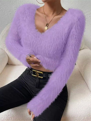 Lavender fluffy v-neck knit top with long sleeves.