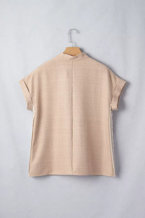 Beige crochet lace pullover with rolled sleeves and mock neck.