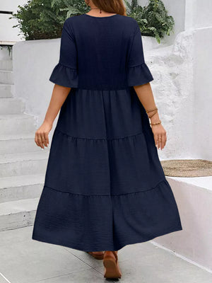 Navy blue midi dress with ruffle sleeves and tiered skirt
