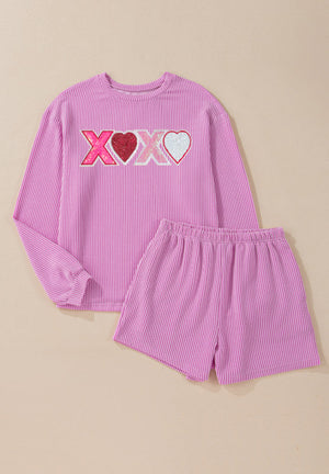 Pink textured loungewear set with XOXO graphic and heart details.