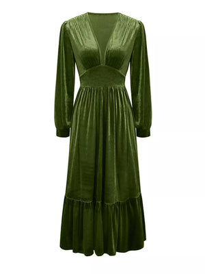Elegant dark green velvet maxi dress with voluminous sleeves and ruffled hem
