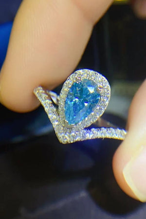 Sky blue pear halo ring with diamond chevron band