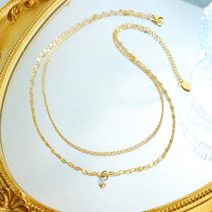 Gold layered necklace with a delicate bow and crystal pendant, 14K gold-plated