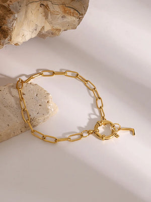 Gold chunky chain bracelet with toggle clasp and initial charm