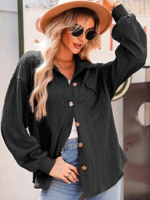 Black textured oversized button-down shacket with button details and a collared neckline.