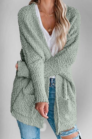 Textured popcorn knit open cardigan in Gum Leaf with pockets and long sleeves.