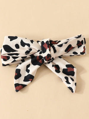 Baby headband with leopard print and bow detail, 100% polyester