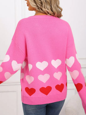 Rose red acrylic crew neck sweater with allover heart print.