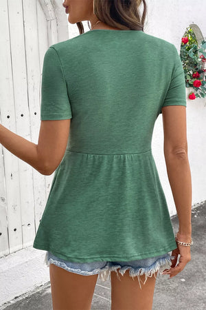 Green polyester short-sleeve V-neck blouse with a twist knot detail and peplum hem.