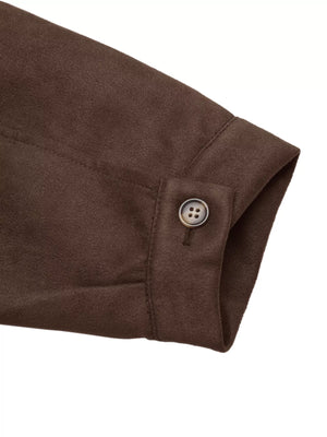 Brown long-sleeve jacket cuff with a button detail