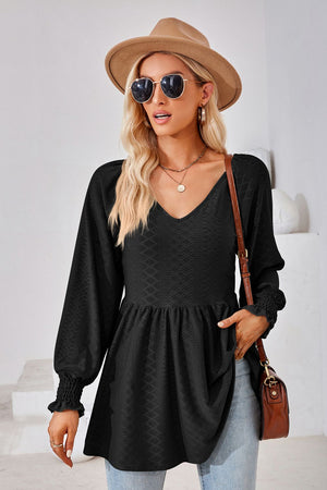 Black textured babydoll blouse with v-neck and smocked cuffs