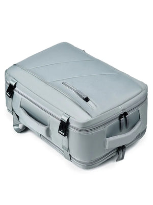 Structured grey travel backpack with top and side handles and shoe compartment detail.