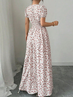 Floral maxi dress with V-neck, short sleeves, smocked waist, and red floral print on white.