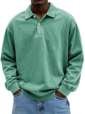Men's vintage washed light green long sleeve cotton polo shirt with buttoned placket.