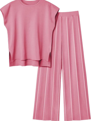 Seamed knit wide-leg co-ord set in Dusty Pink, featuring a cap-sleeve top with side slits and pleated pants.