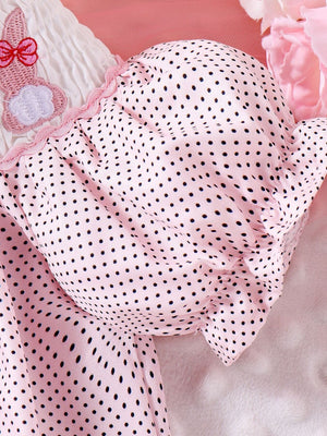 Pink polka dot baby dress with embroidered bunny detail and smocked white bodice.