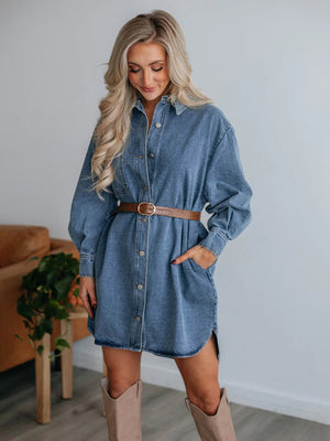 Oversized medium wash denim shirtdress with button front, side slits, and belt