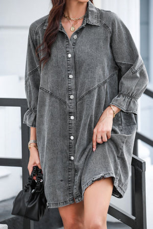 Gray denim shirtdress with button front and ruffled cuff detail.