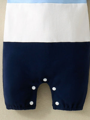 Baby one-piece with color block navy, white, and sky blue.