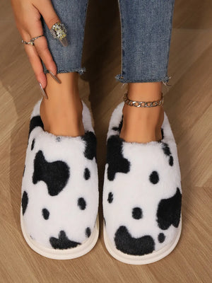 Cow print faux fur house slides with plush lining and cream sole
