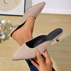 Apricot pointed-toe kitten heel mules with a suede-like texture.