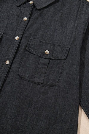 Relaxed black denim shirt with buttoned patch pockets and collar detail.