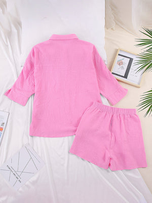 Pink gauze cotton resort shirt and shorts set with buttoned shirt and elastic waist shorts.