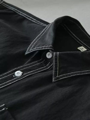 Black men's undershirt with contrast white stitching and buttons