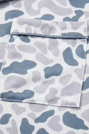 Camouflage print pajama set with blue and grey abstract shapes and a chest pocket.