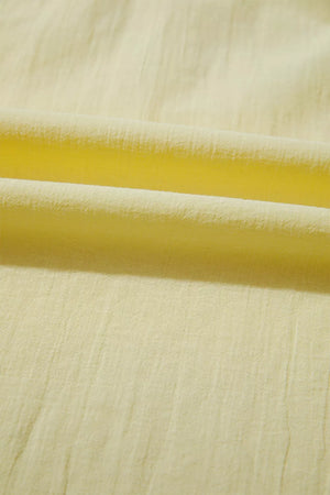 Light yellow cotton blend shirt with textured fabric detail