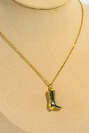 Gold cowboy boot charm necklace with intricate detailing on a delicate chain.
