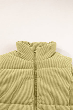Sage corduroy padded vest with a high collar and zipper detail.