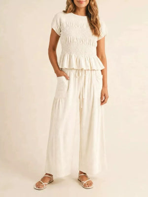 Smocked Peplum Top And Wide-leg Pants Set in Terracotta, close-up detail